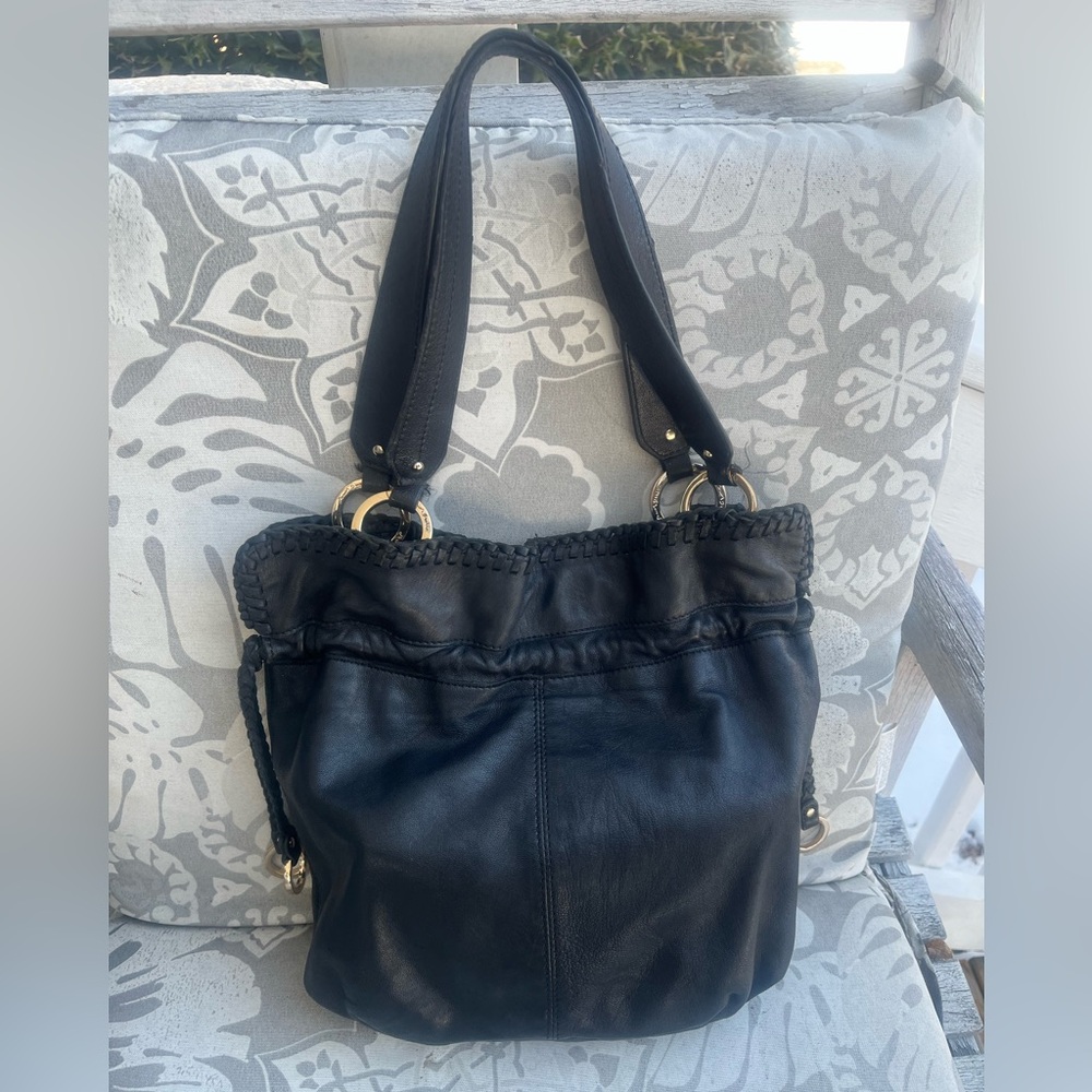 Junior Drake hobo leather handbag with tassel.